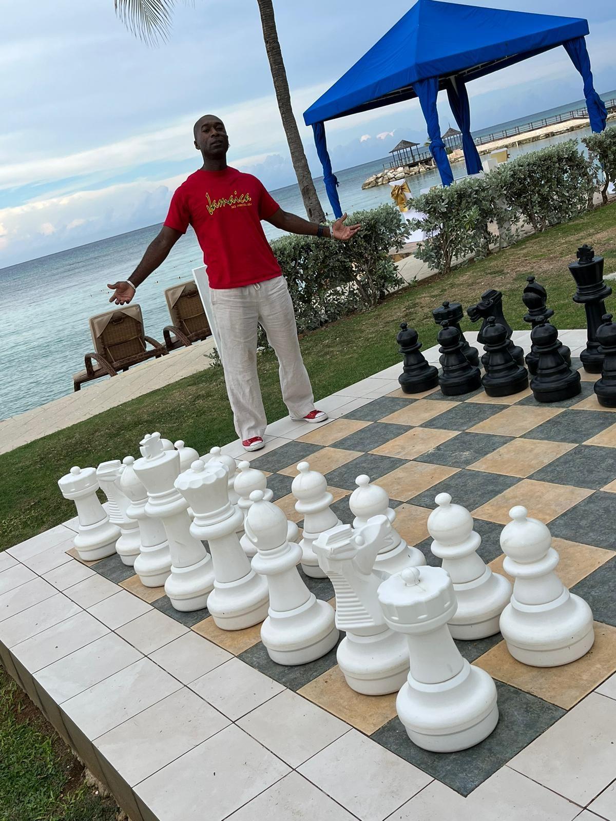 Chess master with giant chess board